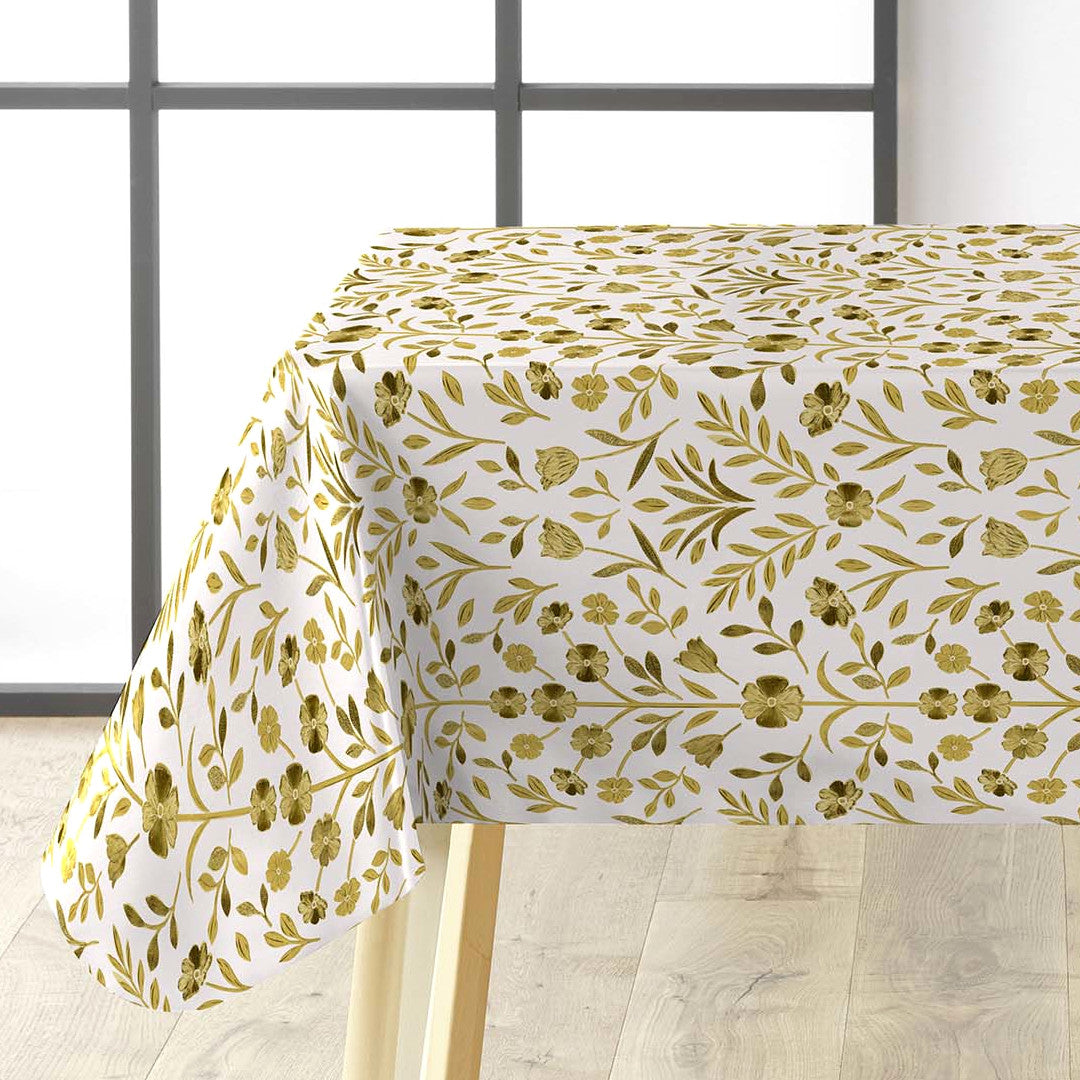 Guldflor voksduk lagt over bord med elegant mønster