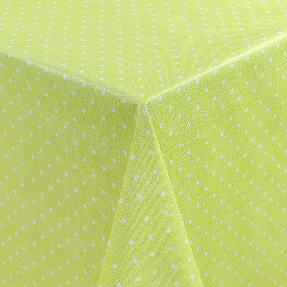 Polkaprikker på grønn bunn – voksduk med lett preget overflate