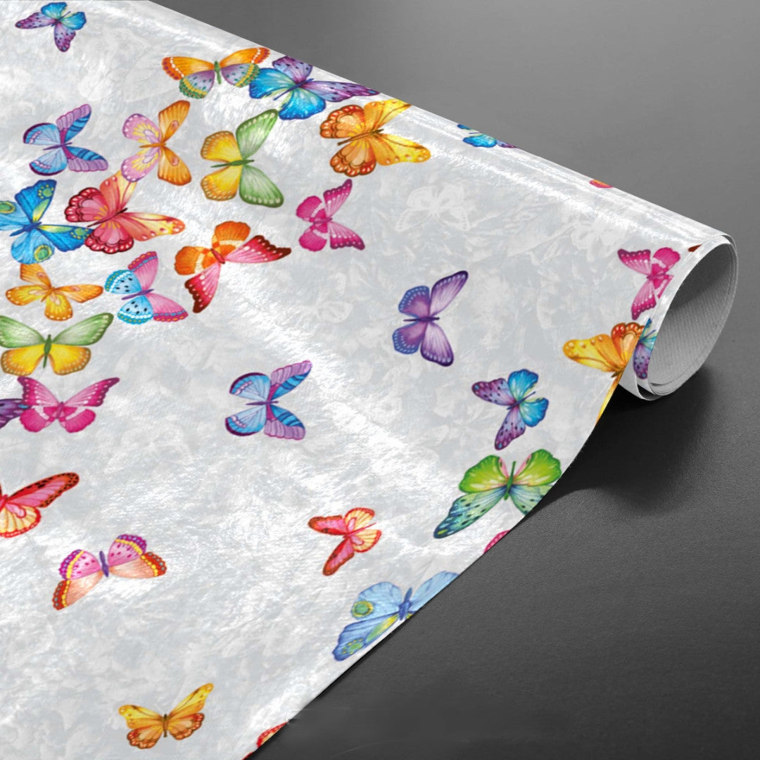 Voksduk med sommerfugler på rad og i mange farger