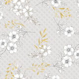 Hortense – Voksduk med blomstrete mønster i gyldne og nøytrale toner