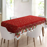 Nisseby – Rød julevoksduk med julenisse og snødekt landskap, miljø