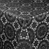 Noir Chantilly – Svart blondevoksduk med grafisk rosettmønster