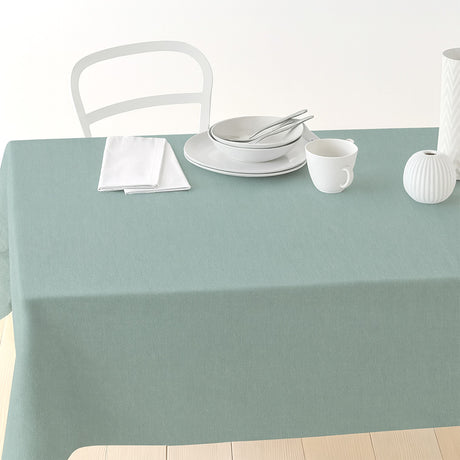 Nordfavn Dean Støvet Grønn – Ensfarget akrylduk i linlook, på bord