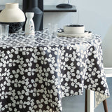 Poppy Graphite - Lola voksduk med grafisk blomsterdesign, hjørne