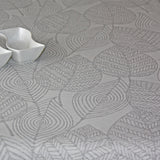 Amberes Jacquard, grå blader. Jacquardvevd akrylduk med grå strekblader på naturfarget bunn