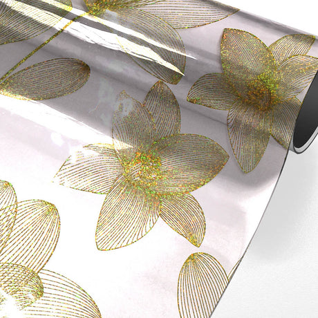 Danela Gold – Gjennomsiktig voksduk, strekblomster og glittereffekt, rullet