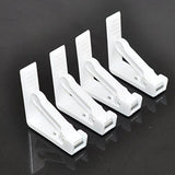 Dukholdere i hvit plast. Sett med 4 stk.