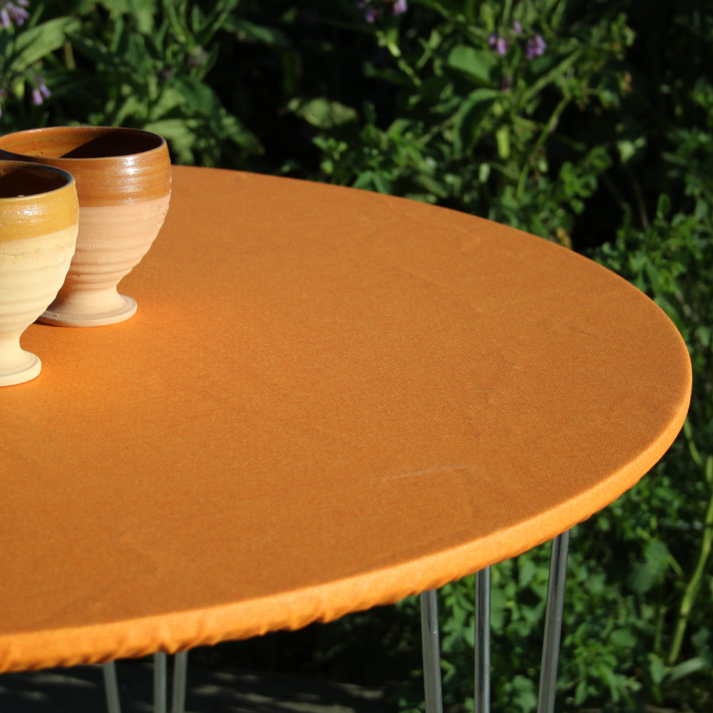 Ensfarget akrylduk i appelsin - rund akrylduk med elastisk kant