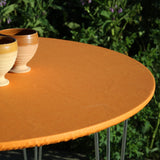 Ensfarget akrylduk i appelsin - rund akrylduk med elastisk kant