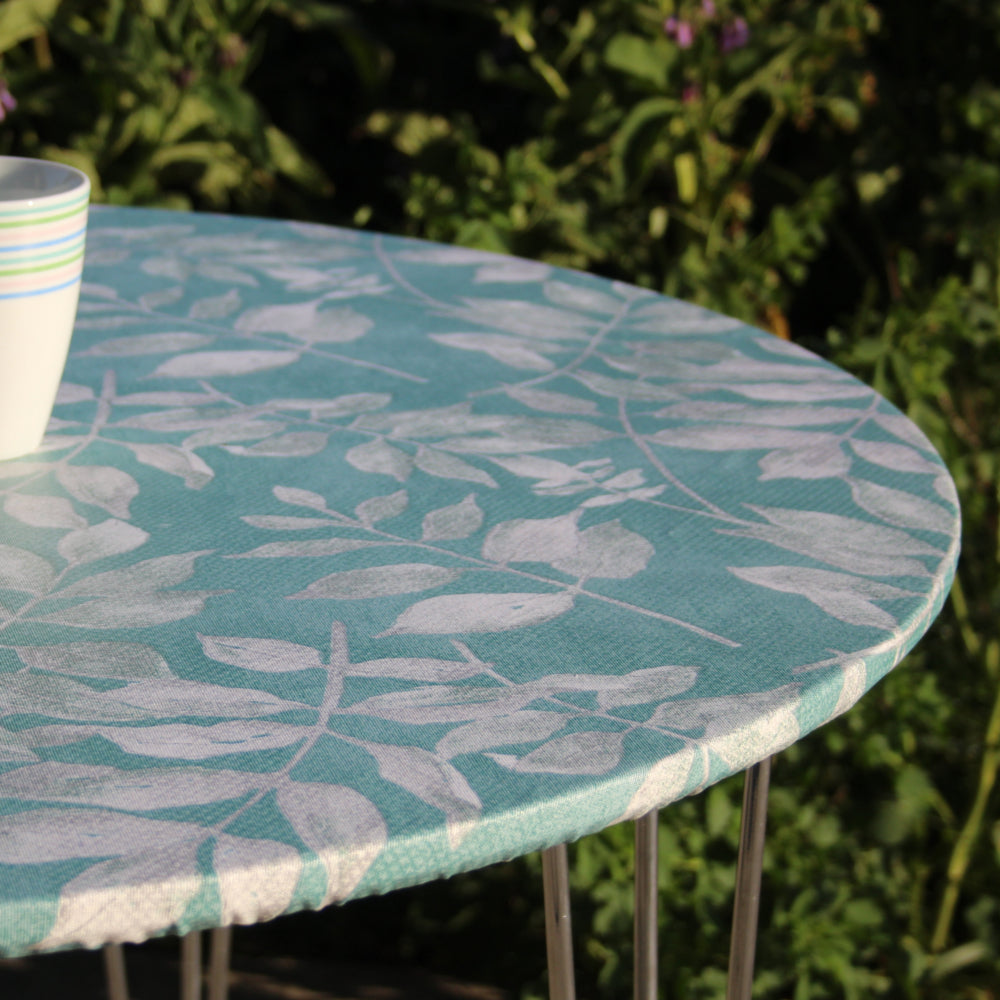 Foppa blålige farger - rund akrylduk med strikkant