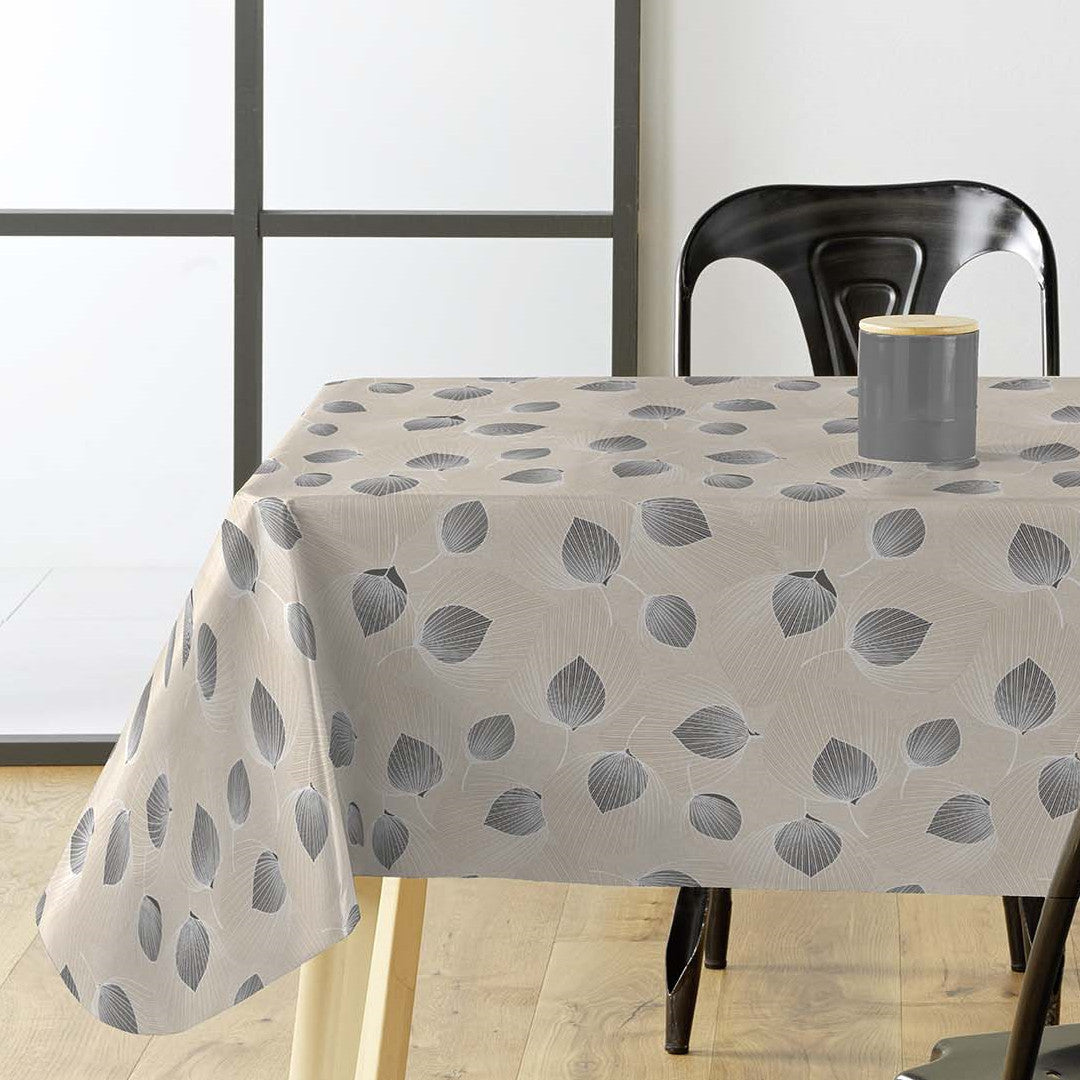 Helga Grå voksduk på bord med spennende bladmønster og lys grå/beige bunn