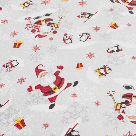 Nærbilde av Julefest på Sydpolen juleduk med julenisser og pingviner i snøen