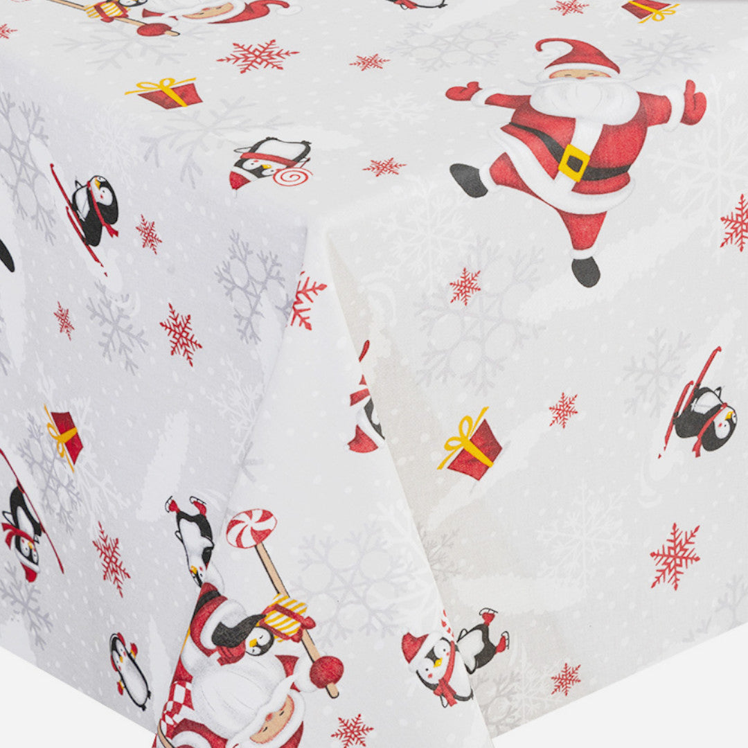 Hjørne av Julefest på Sydpolen juleduk med glade julenisser og kristtorn