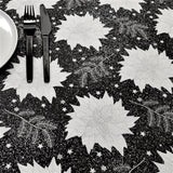 Julestjerne Sort - Juleakrylduk med julestjerner, gran og glitter, 155 cm bred