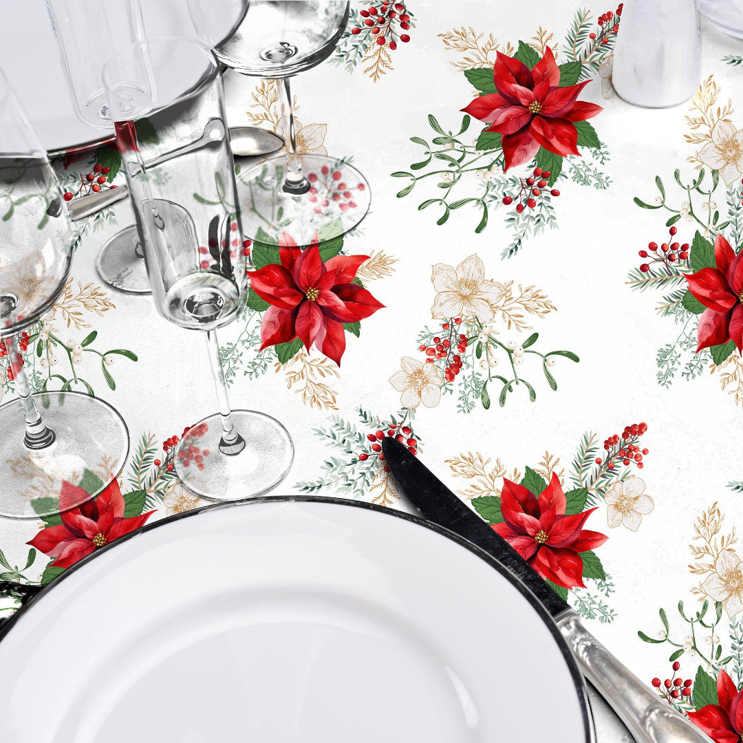 Nærbilde av julevoksduk med julestjerner og elegant borddekking