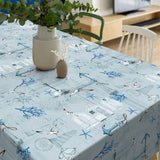 Under Himmelen – Over havet – lys grå/blå voksduk med maritime motiver