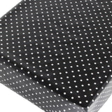 Voksduk med hvite prikker på svart bunn