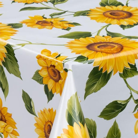 Solsikker – voksduk i gule og oransje farger på hvit bunn, 140 cm